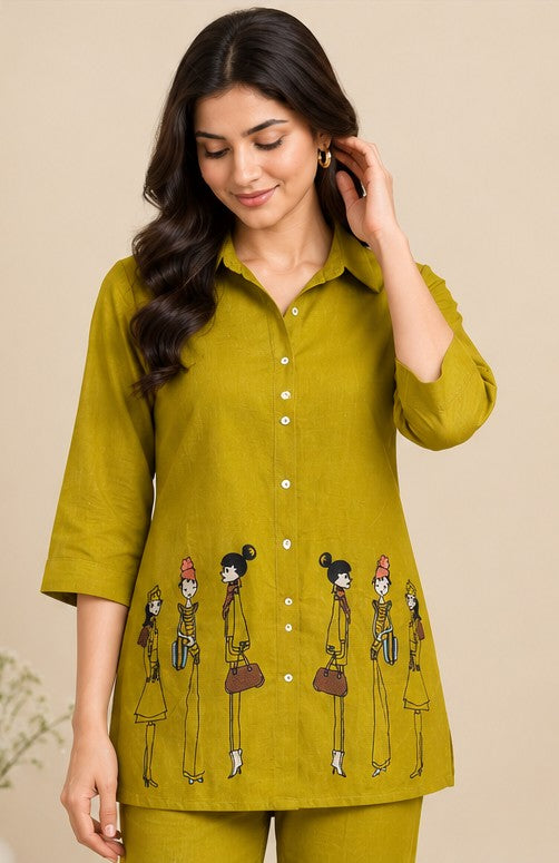 Close-up of collared shirt with figurine motifs and button front